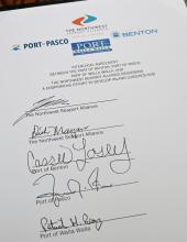 A photo of an interlocal agreement to develop an Inland Logistics Hub signed by officials during a ceremony in Olympia on Thursday, February 5, 2026.