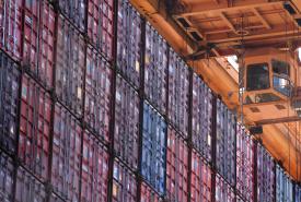 container crane by a row of containers